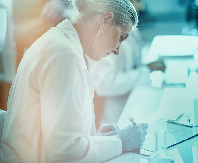 Scientist working at a laboratory bench during immunology research