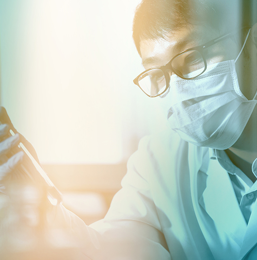 Healthcare professional conducting research in a laboratory setting.